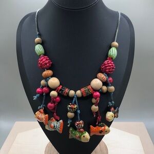 Vintage boho rustic folk art wooden bead fish dangle charms corded tie up.